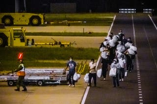 Passengers on a third evacuation flight from Tenerife arrive at Eindhoven Air Base in Eindhoven, Netherlands on 12 May 2026